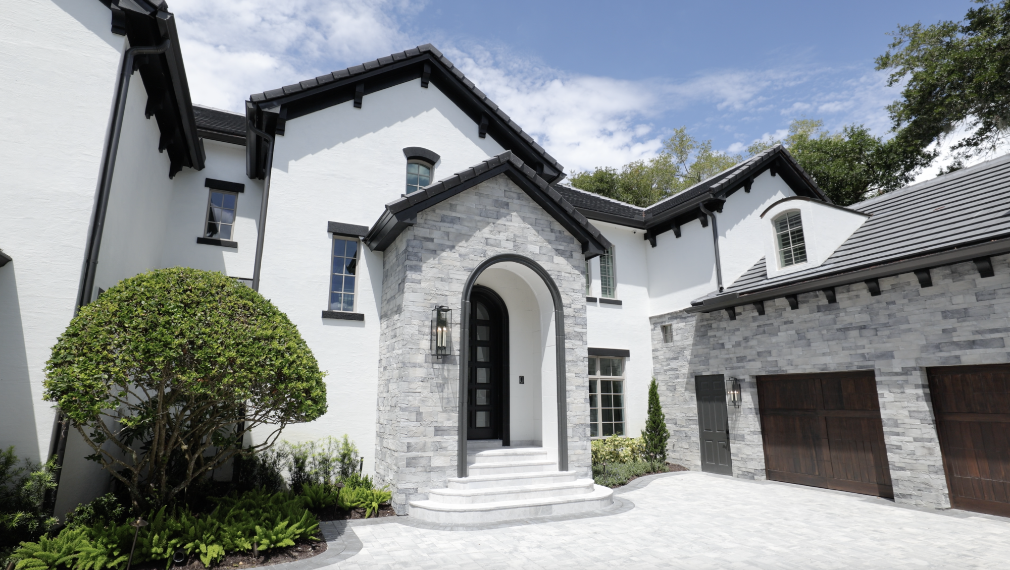 front view of home with black and white paint